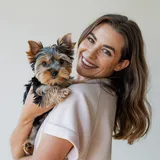Happy pet owner with small pet